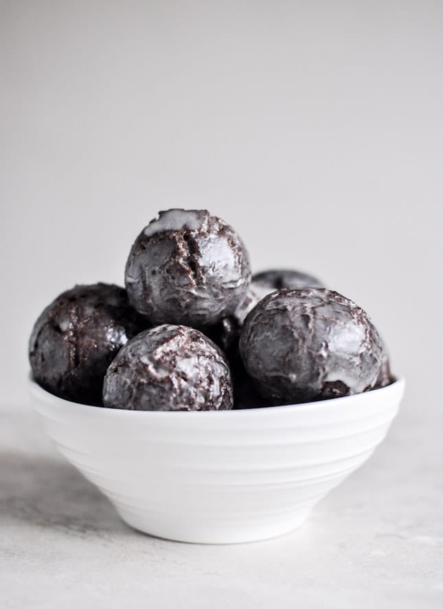 Glazed and Sprinkled Chocolate Cake Donut Holes I howsweeteats.com Glazed and Sprinkled Chocolate Cake Donut Holes I howsweeteats.com
