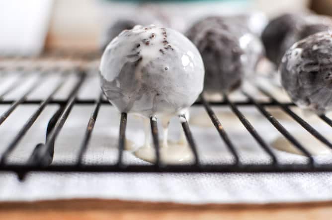 Glazed and Sprinkled Chocolate Cake Donut Holes I howsweeteats.com Glazed and Sprinkled Chocolate Cake Donut Holes I howsweeteats.com