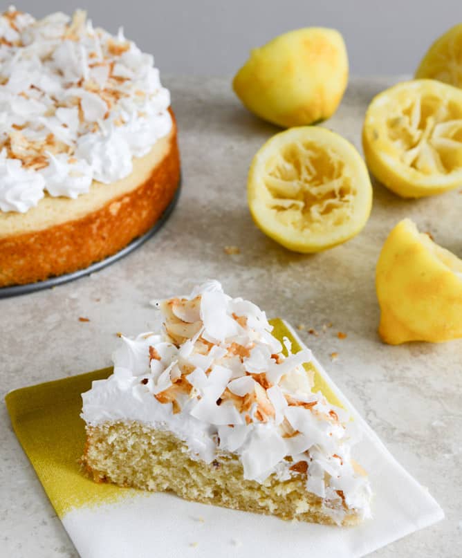Easy Lemon Cake with Marshmallow Frosting + Toasted Coconut I howsweeteats.com Easy Lemon Cake with Marshmallow Frosting + Toasted Coconut I howsweeteats.com