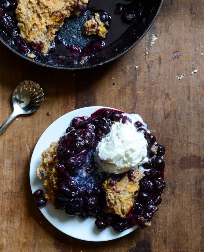 Skillet Blueberry Cobbler with a Cheddar Biscuit Crust I howsweeteats.com Skillet Blueberry Cobbler with a Cheddar Biscuit Crust I howsweeteats.com