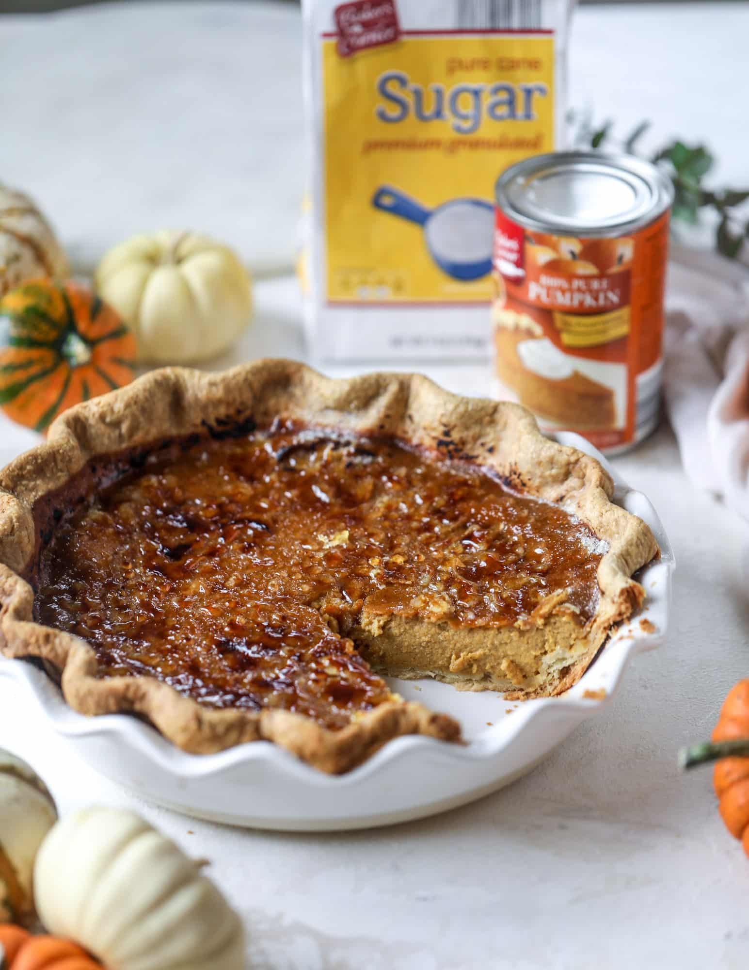 This brûlée pumpkin pie is the best of both worlds in pumpkin desserts! A delicious flaky crust, a creamy pumpkin filling and a crunchy, crispy topping - brûléed sugar right before serving. It's a whole new way to serve pumpkin pie! I howsweeteats.com #pumpkinpie #brulee