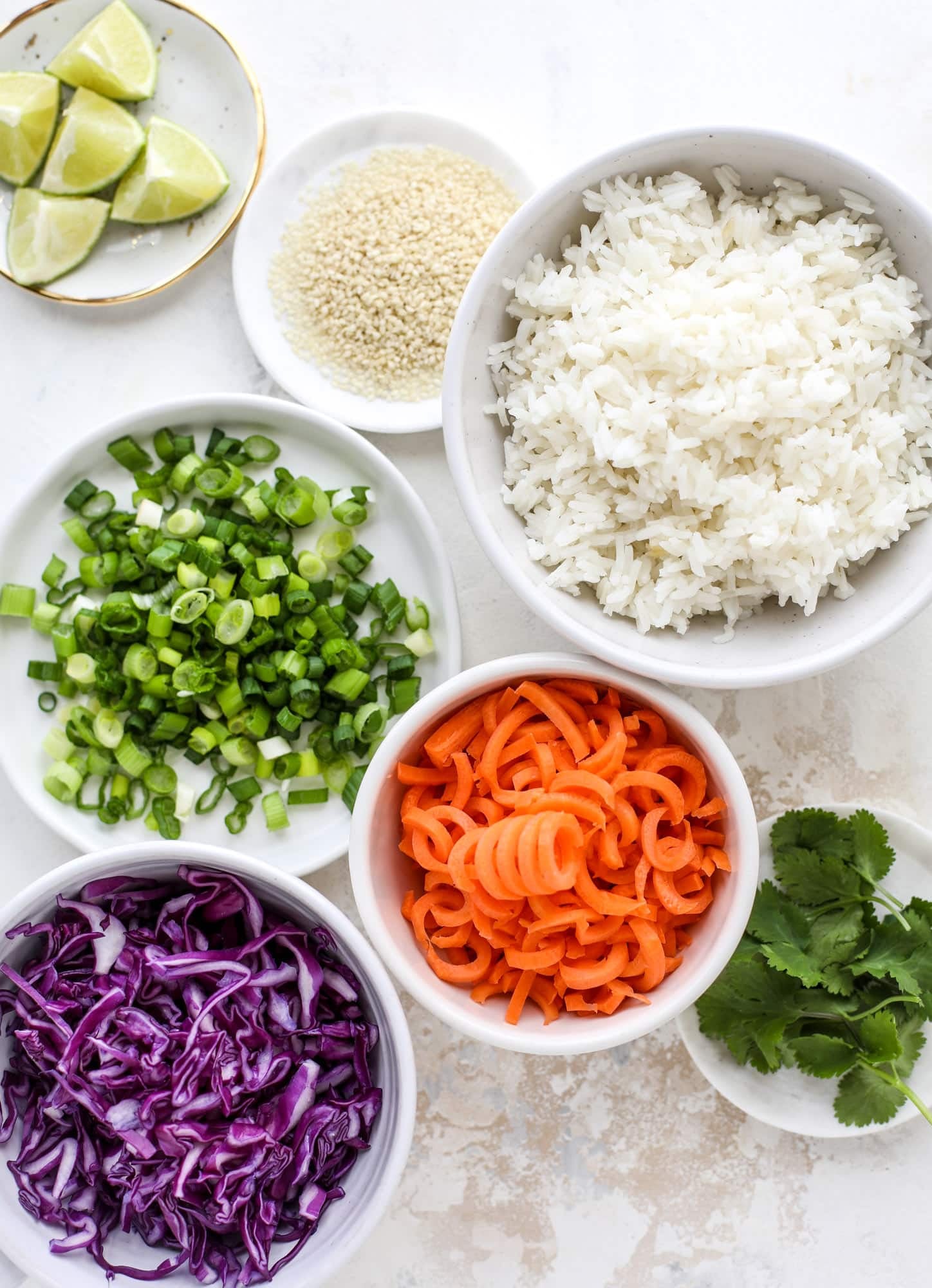 Korean chicken bowls are loaded with flavor: toasted sesame, soy sauce and lime come together over coconut rice and avocado to create a delicious meal! I howsweeteats.com #korean #chicken