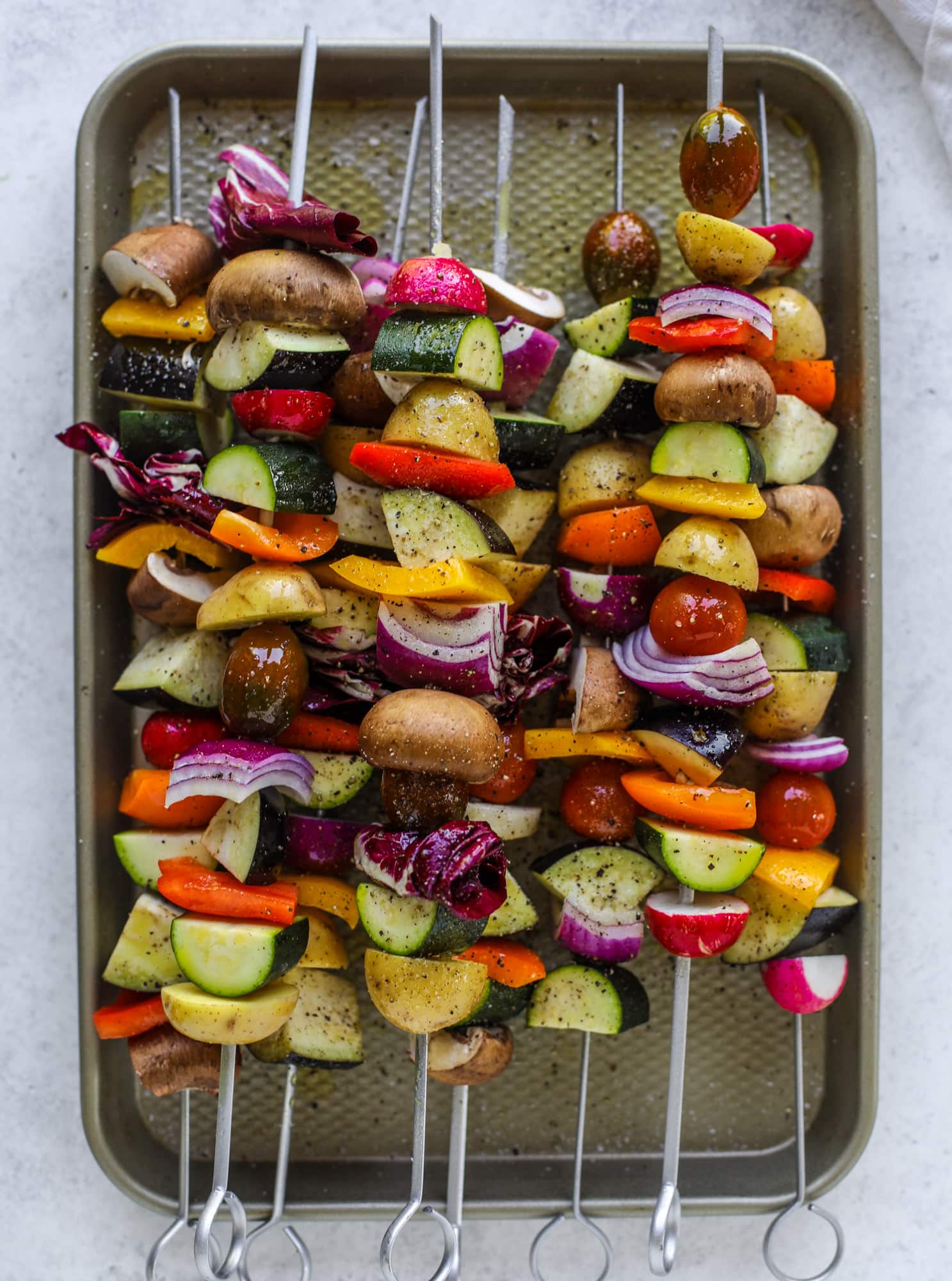 vegetable skewers prepped for the grill