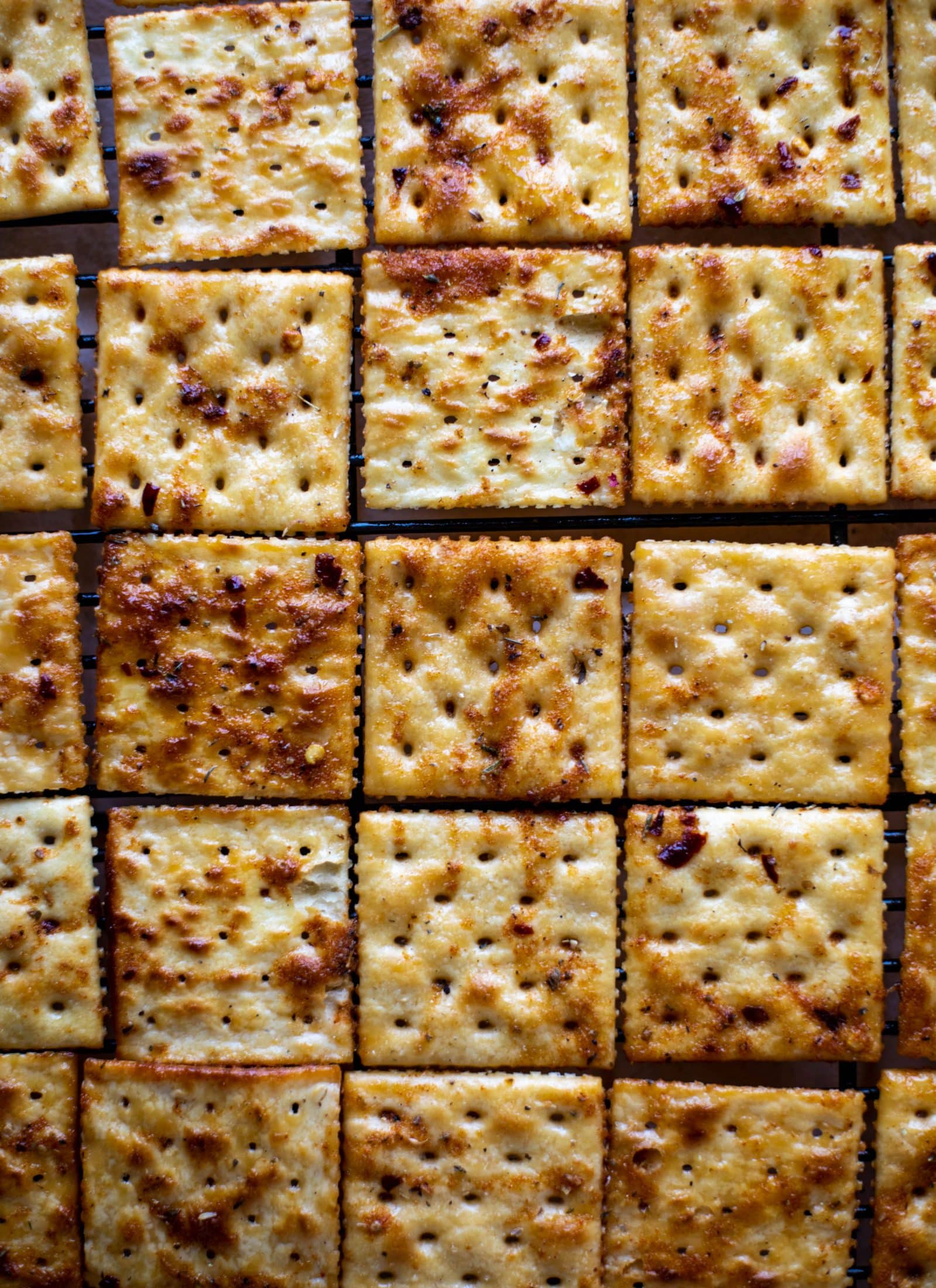 These super easy fire crackers are such a simple recipe to make! Bake the crackers with spice and butter for the perfect party snack.