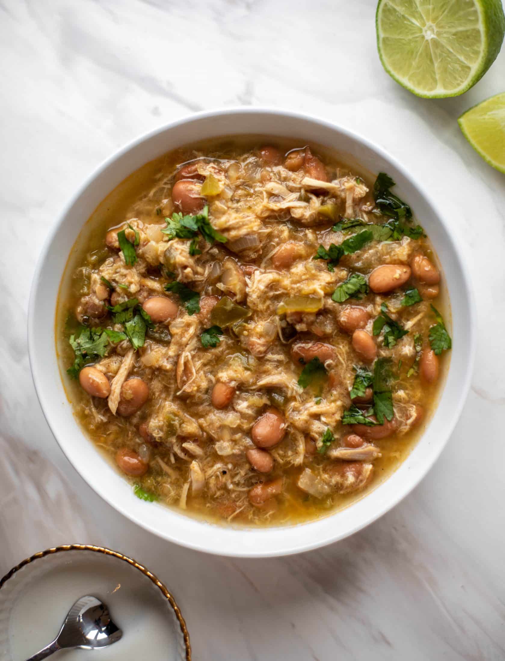 This chicken verde soup is easy to make and comes together quickly. It's served with salted yogurt dolloped on top and it's delish!