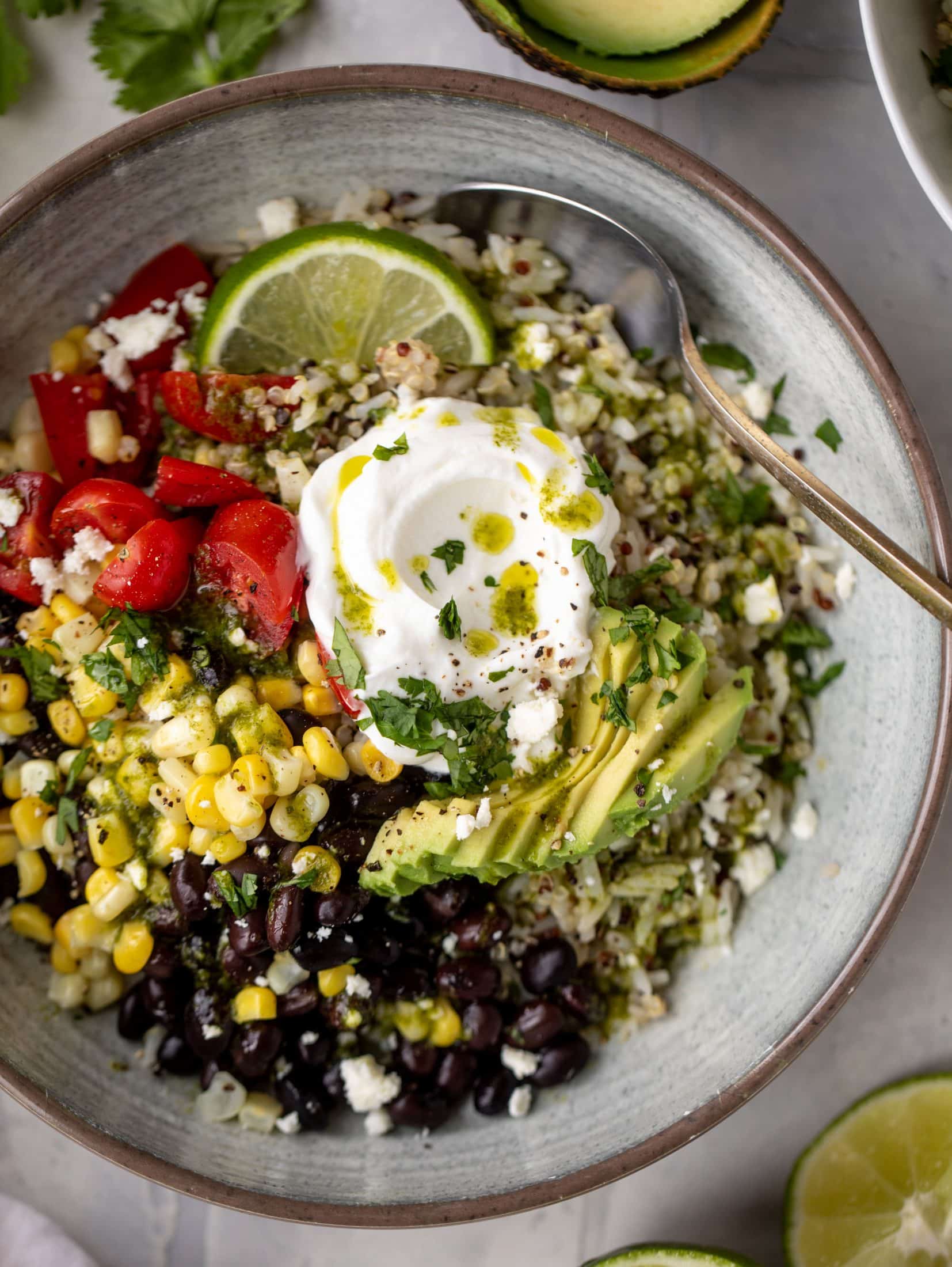 These baja grain bowls are a delicious copycat of the Panera baja grain bowls! Rice, quinoa, beans, tomatoes and cilantro lime vinaigrette!