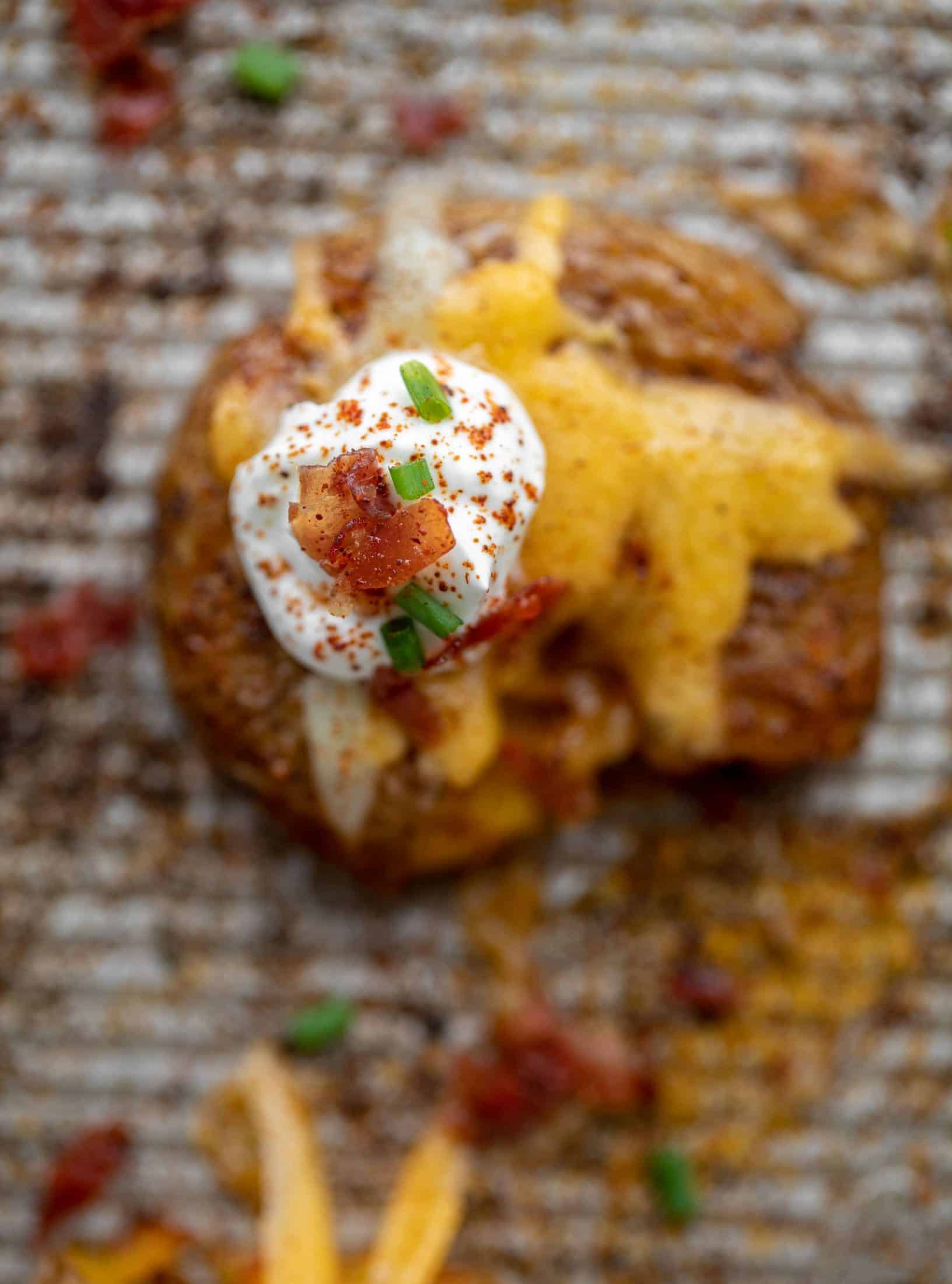 sour cream and bacon on chipotle cheddar smashed potatoes
