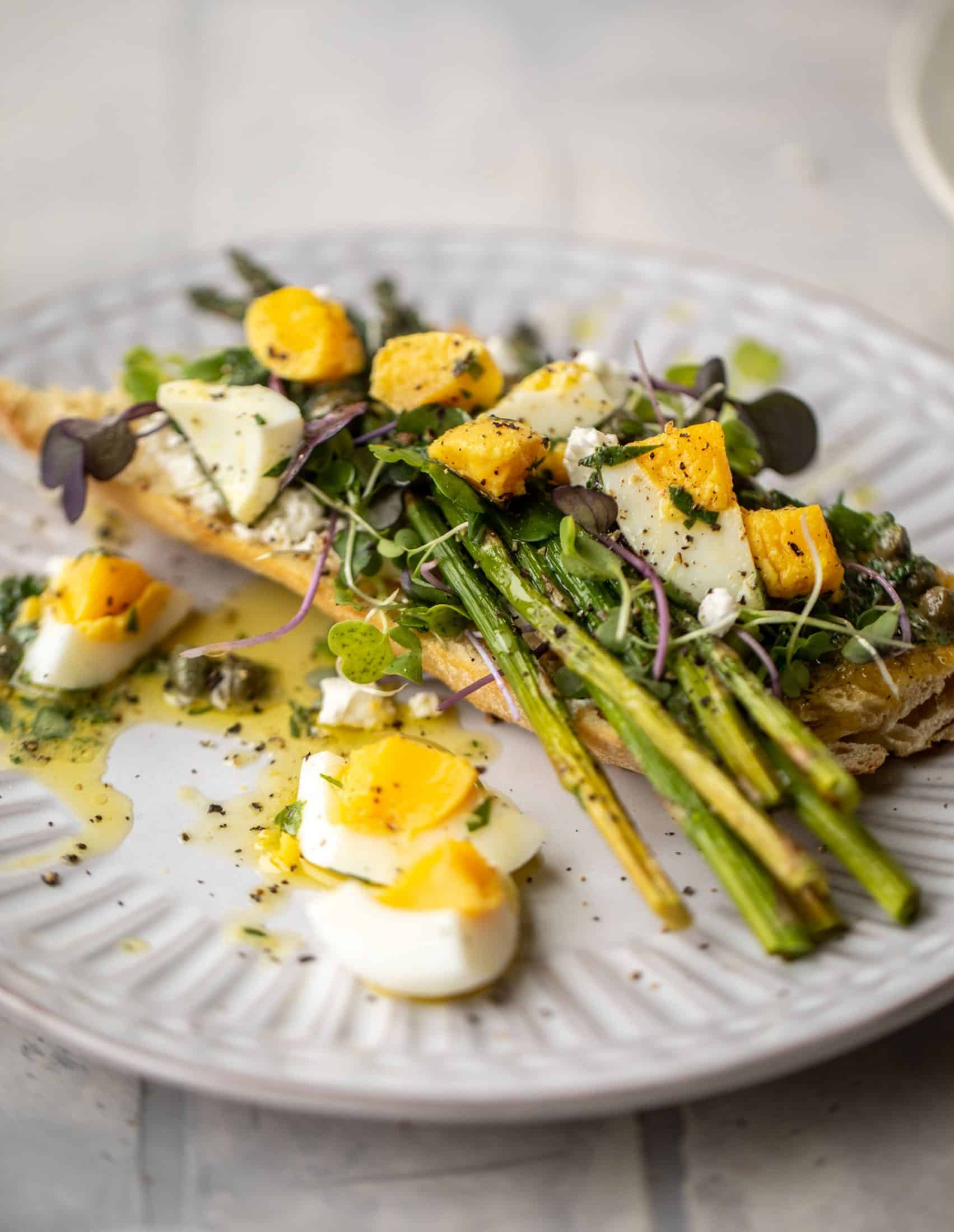This hard boiled egg vinaigrette is a great way to use up leftover hard boiled eggs! It's fabulous on roasted vegetables, salads and toast.