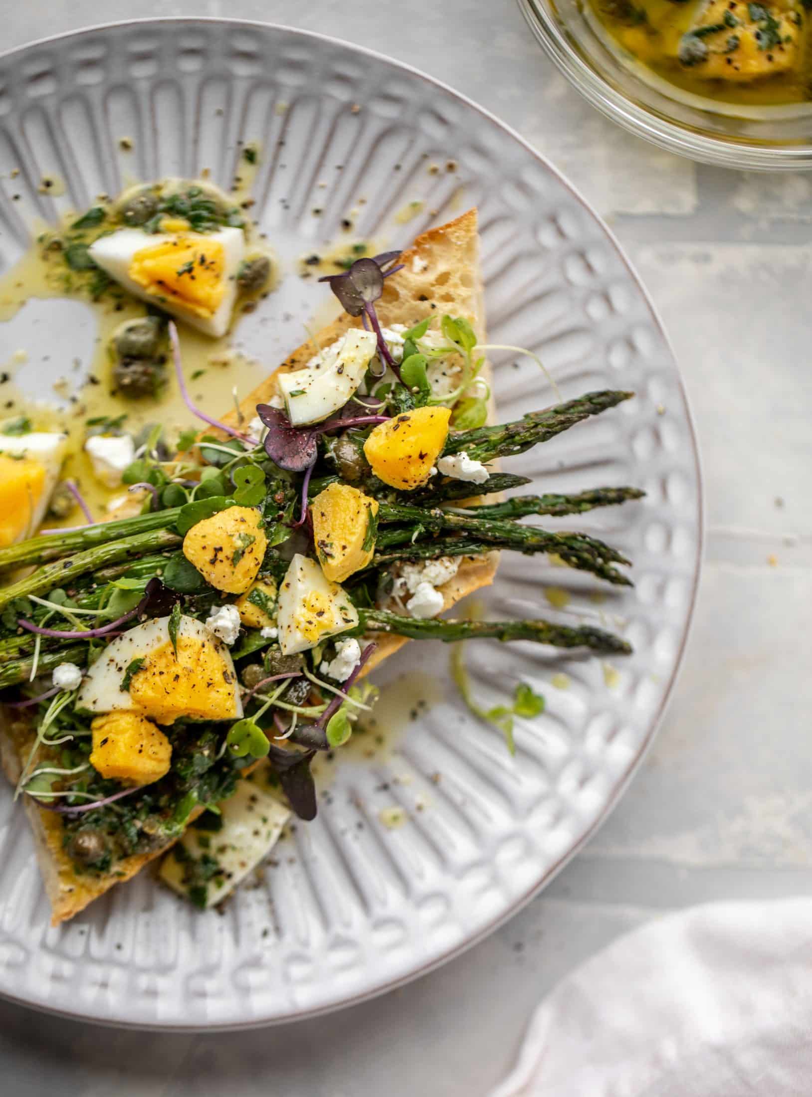 This hard boiled egg vinaigrette is a great way to use up leftover hard boiled eggs! It's fabulous on roasted vegetables, salads and toast.
