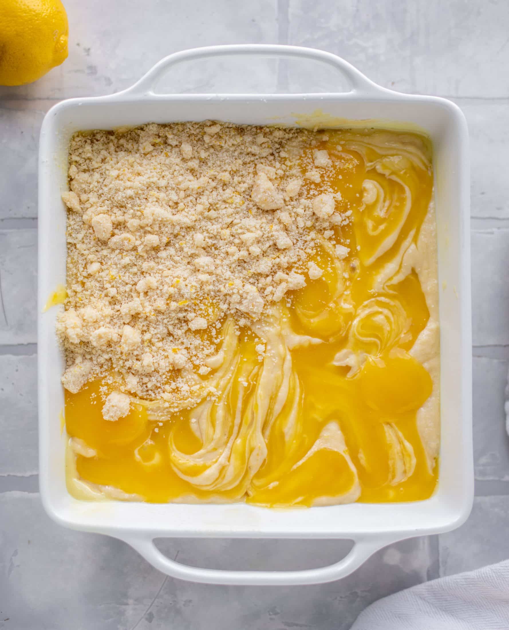 sprinkling crumb on lemon crumb cake