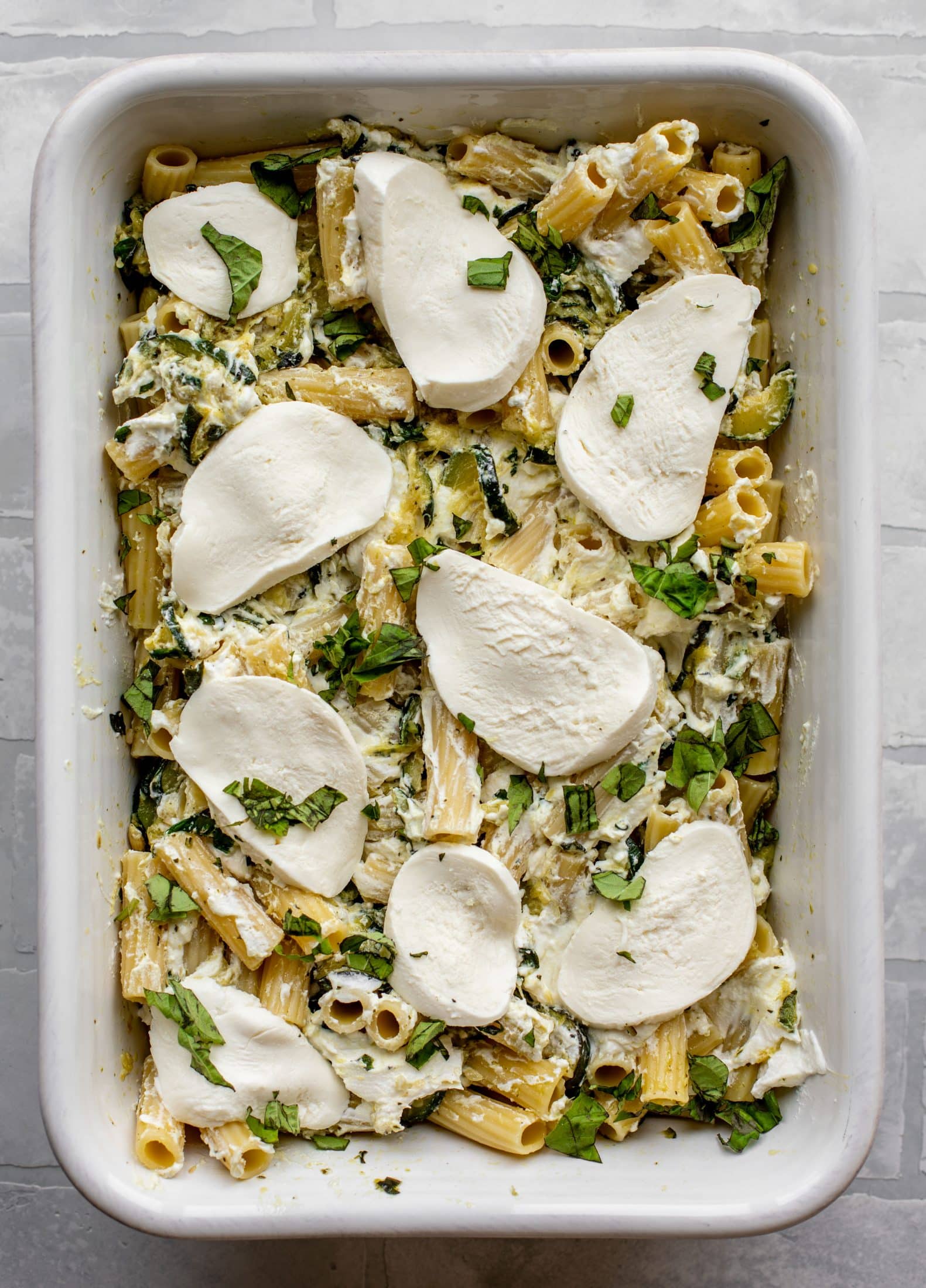 fresh mozzarella covering zucchini ziti