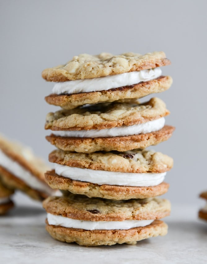 Chewy Black + White Chip Oatmeal Sandwich Cookies with Marshmallow Buttercream Filling I howsweeteats.com