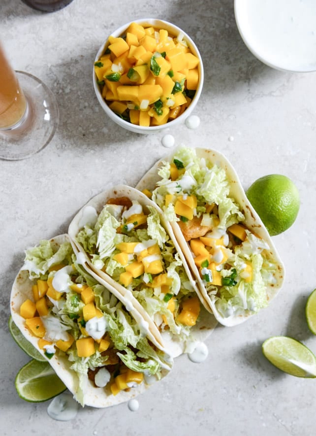 Beer Battered Fish Tacos with Mango Margarita Salsa and Jalapeño Crema I howsweeteats.com