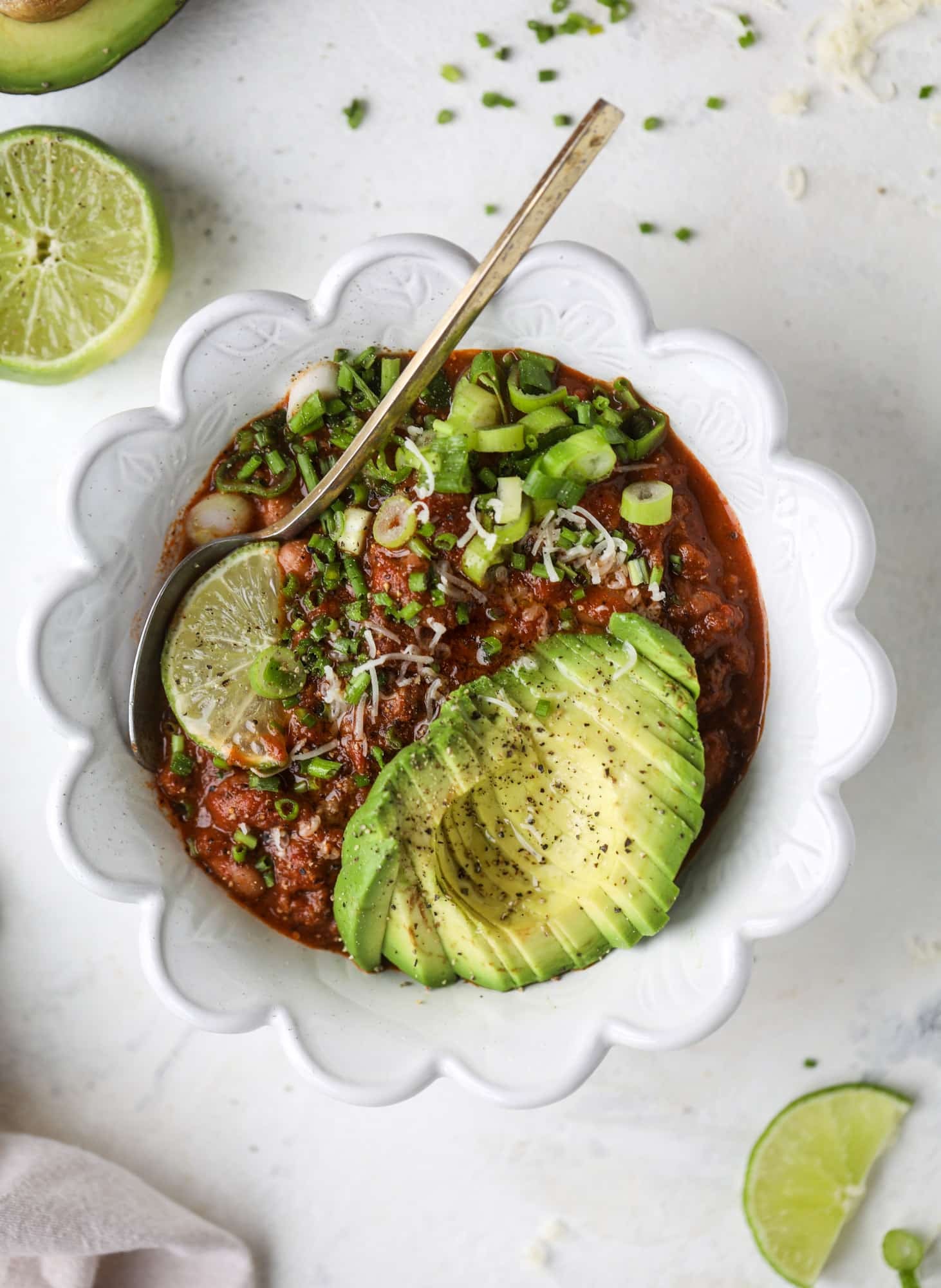 This fire and ice chili has a secret ingredient that makes it rich, velvety and insanely delicious. Dark chocolate ice cream is stirred in before serving and adds a crazy depth of flavor while bringing so much richness to your favorite bowl. You have to try it! I howsweeteats.com #chili #recipe #ice #cream #chili #bar
