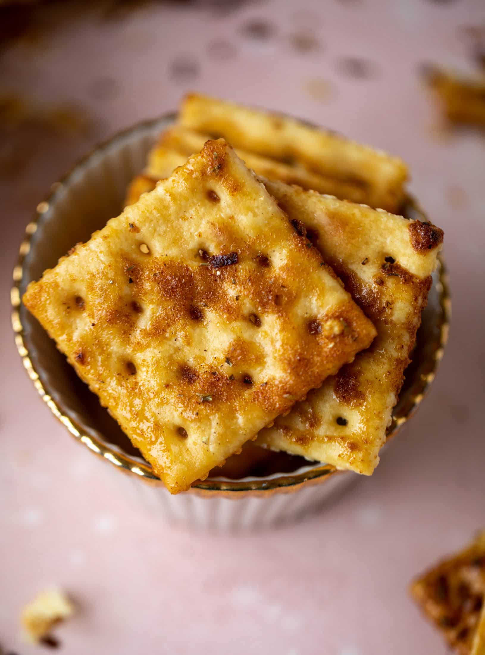 These super easy fire crackers are such a simple recipe to make! Bake the crackers with spice and butter for the perfect party snack.