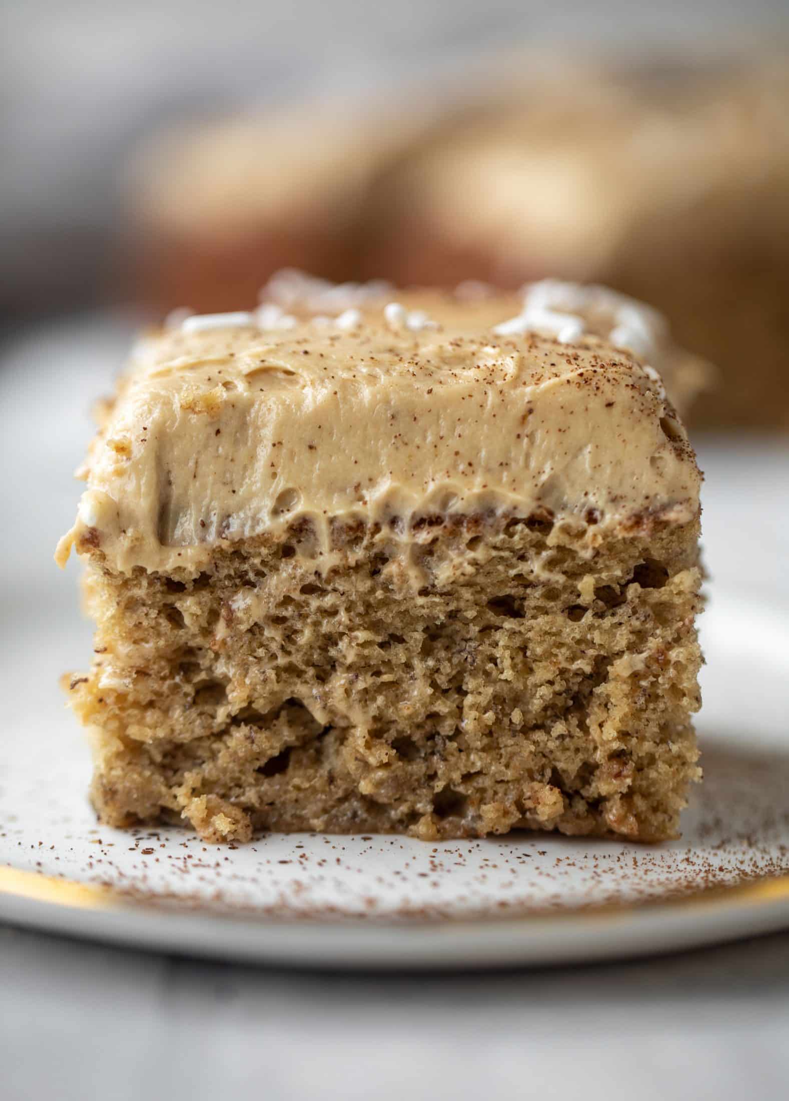 This banana cake is a delicious twist on banana bread! Covered with coffee cream cheese frosting, it’s an easy and wonderful treat.