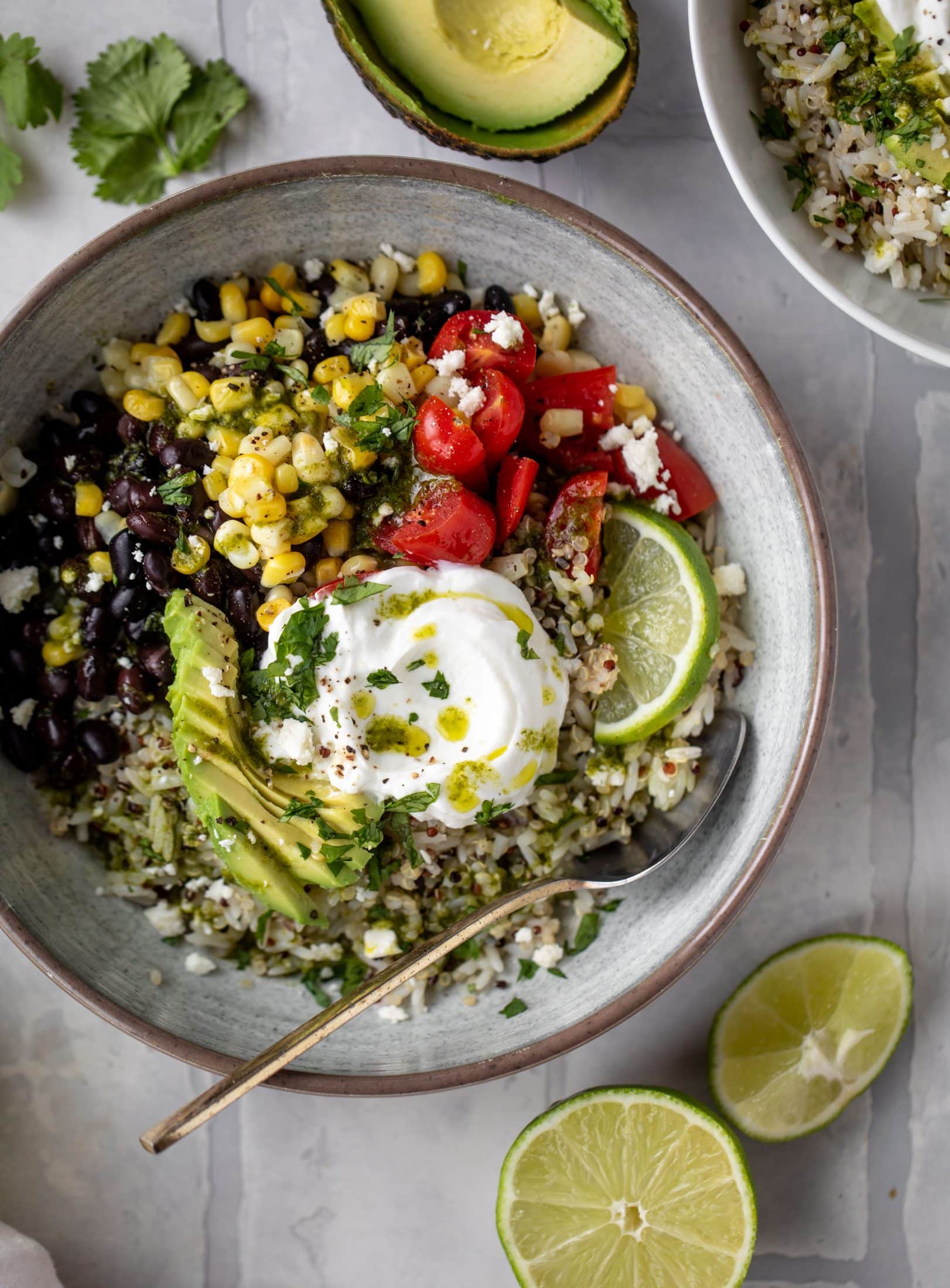 These baja grain bowls are a delicious copycat of the Panera baja grain bowls! Rice, quinoa, beans, tomatoes and cilantro lime vinaigrette!