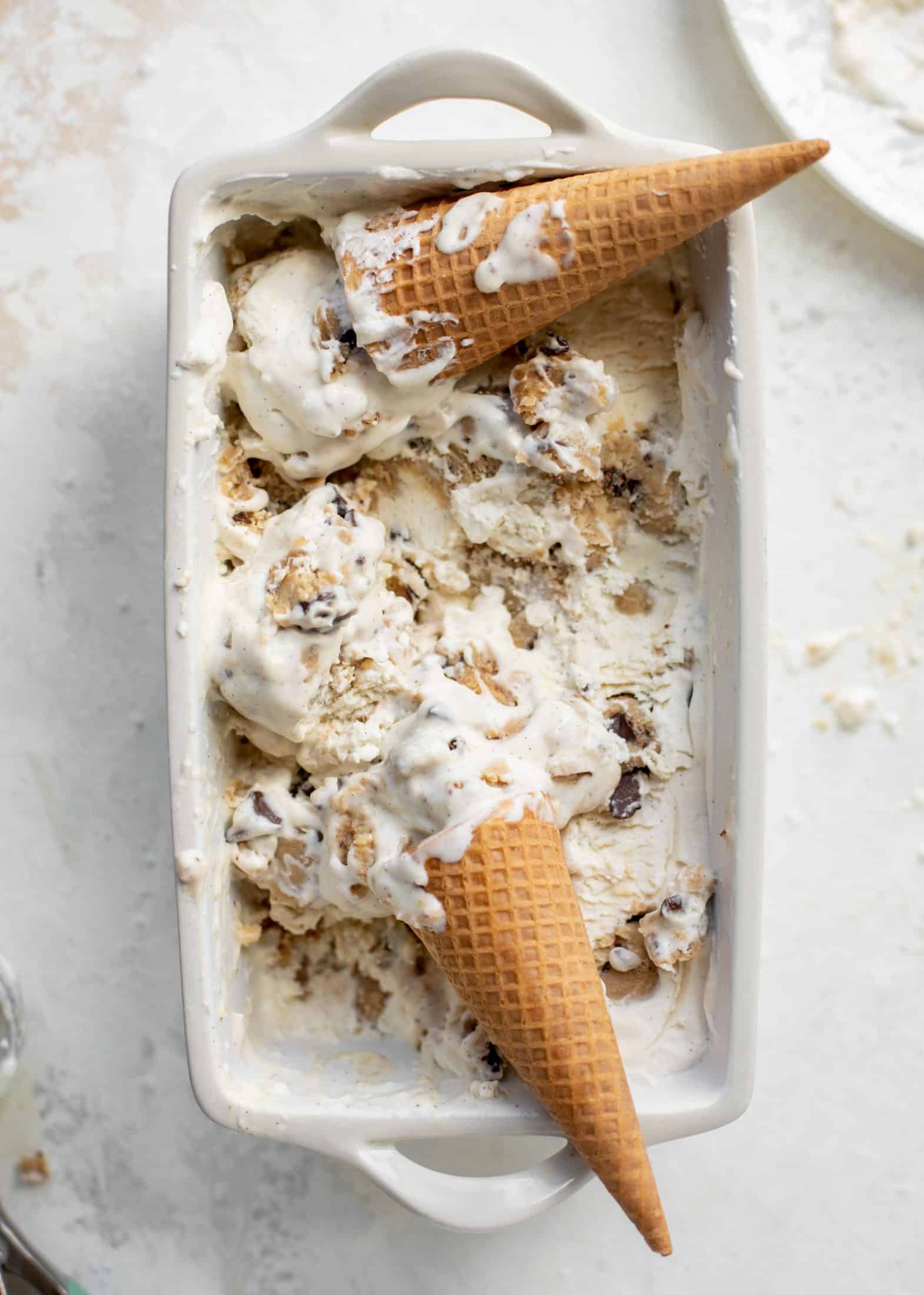 container of no churn salted chocolate chip cookie dough ice cream with cones