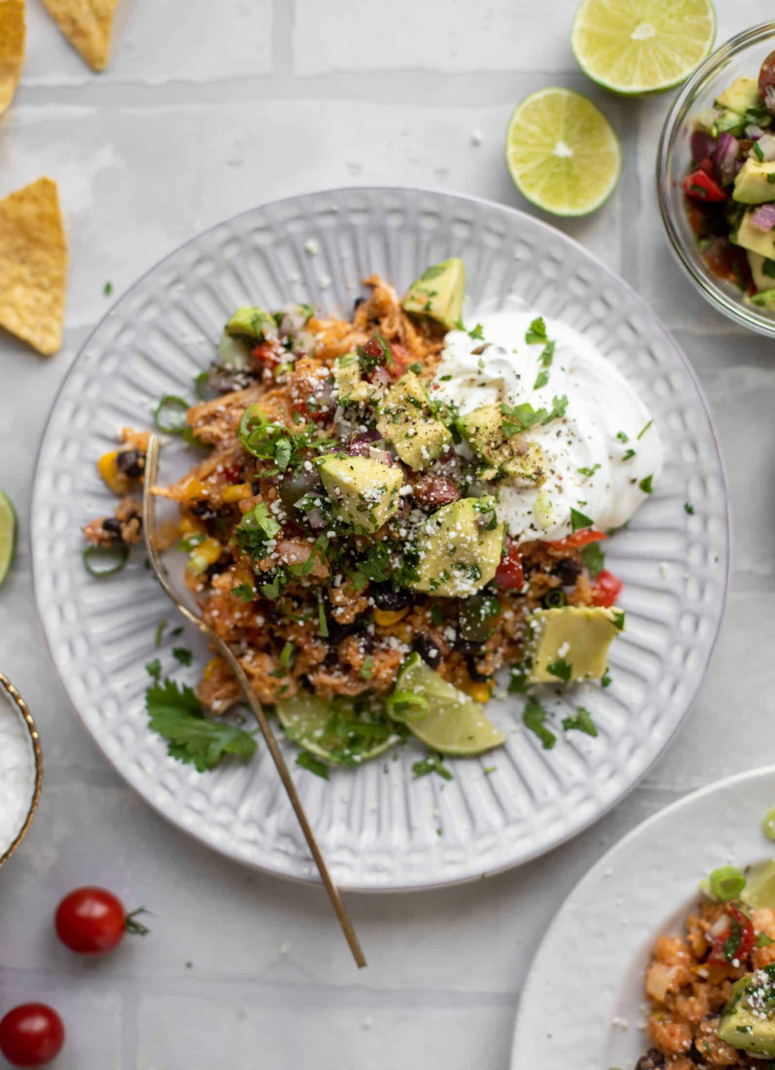 one pot salsa chicken quinoa topped with avocado pico de gallo