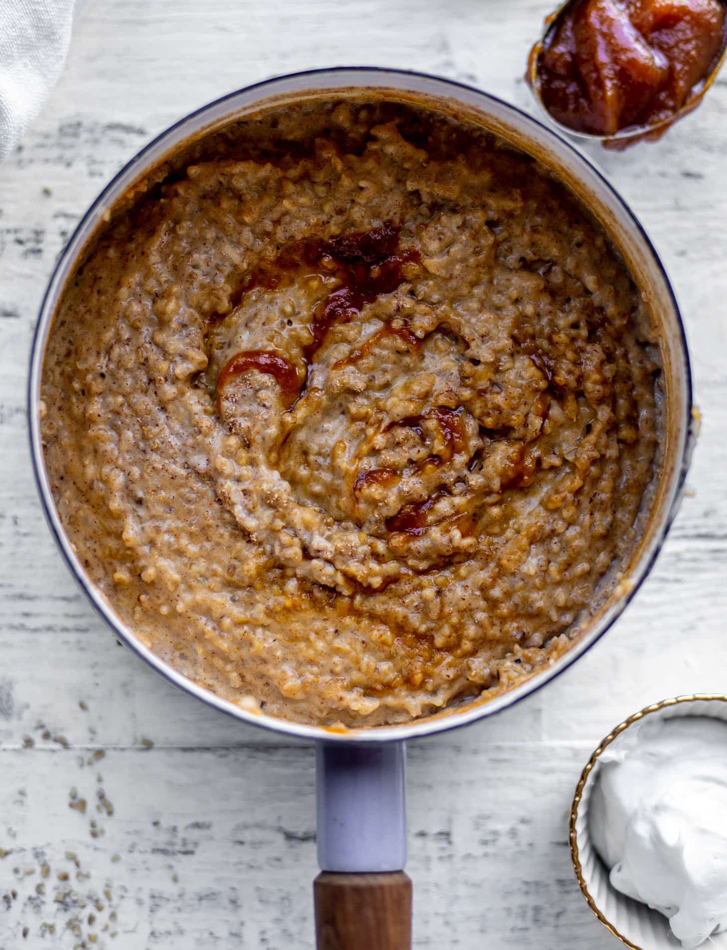 pumpkin pie oatmeal with coconut cream and almonds