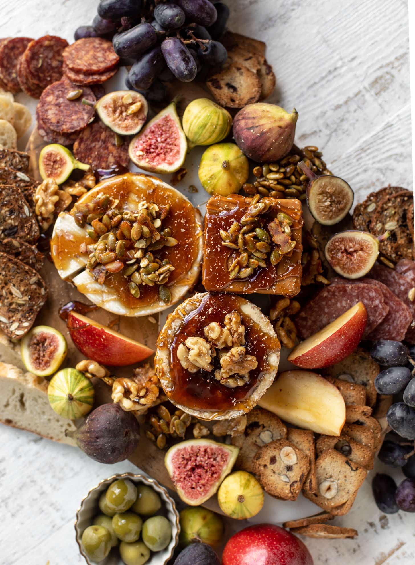 autumn cheese board with bourbon crackling caramel and honey roasted pepitas