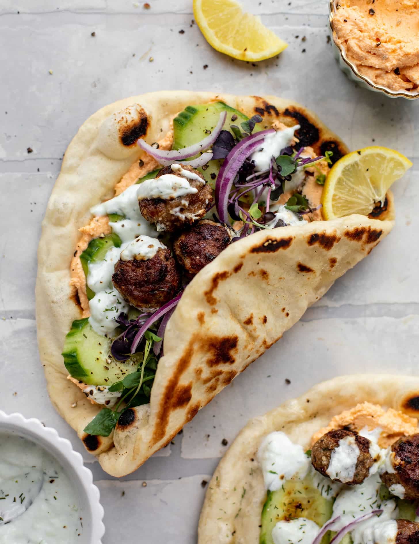 chicken meatball pitas with roasted red pepper whipped feta
