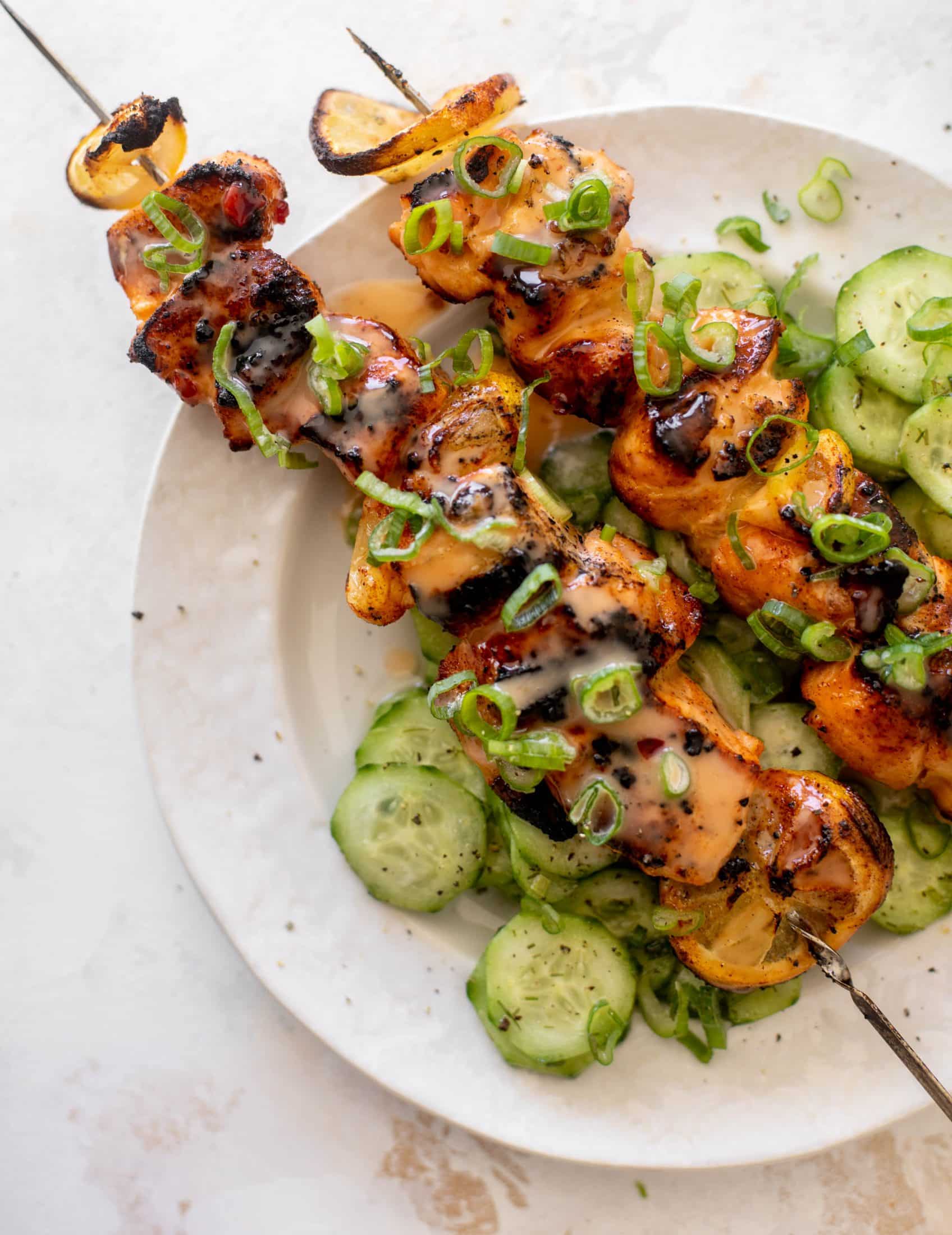 grilled bang bang salmon with cucumber salad