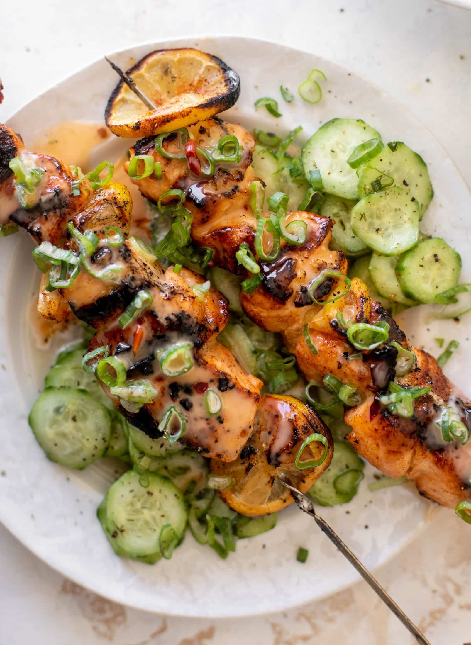 grilled bang bang salmon with cucumber salad
