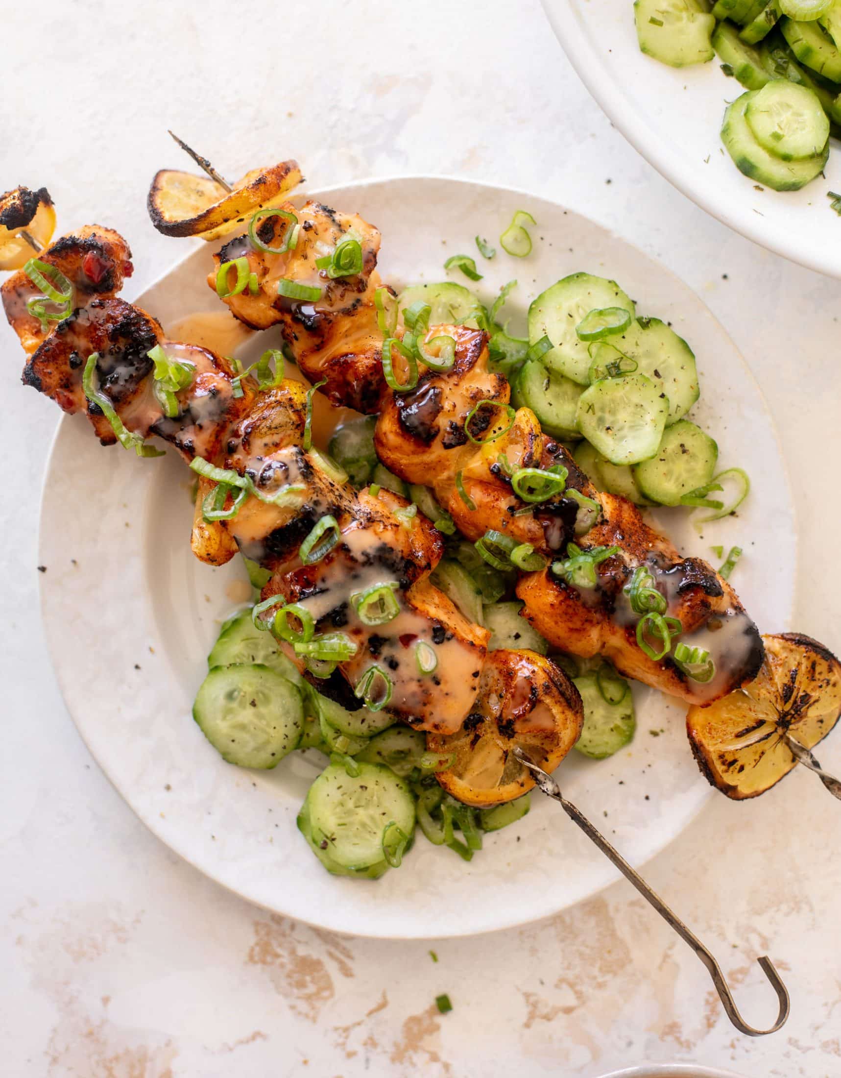 grilled bang bang salmon with cucumber salad