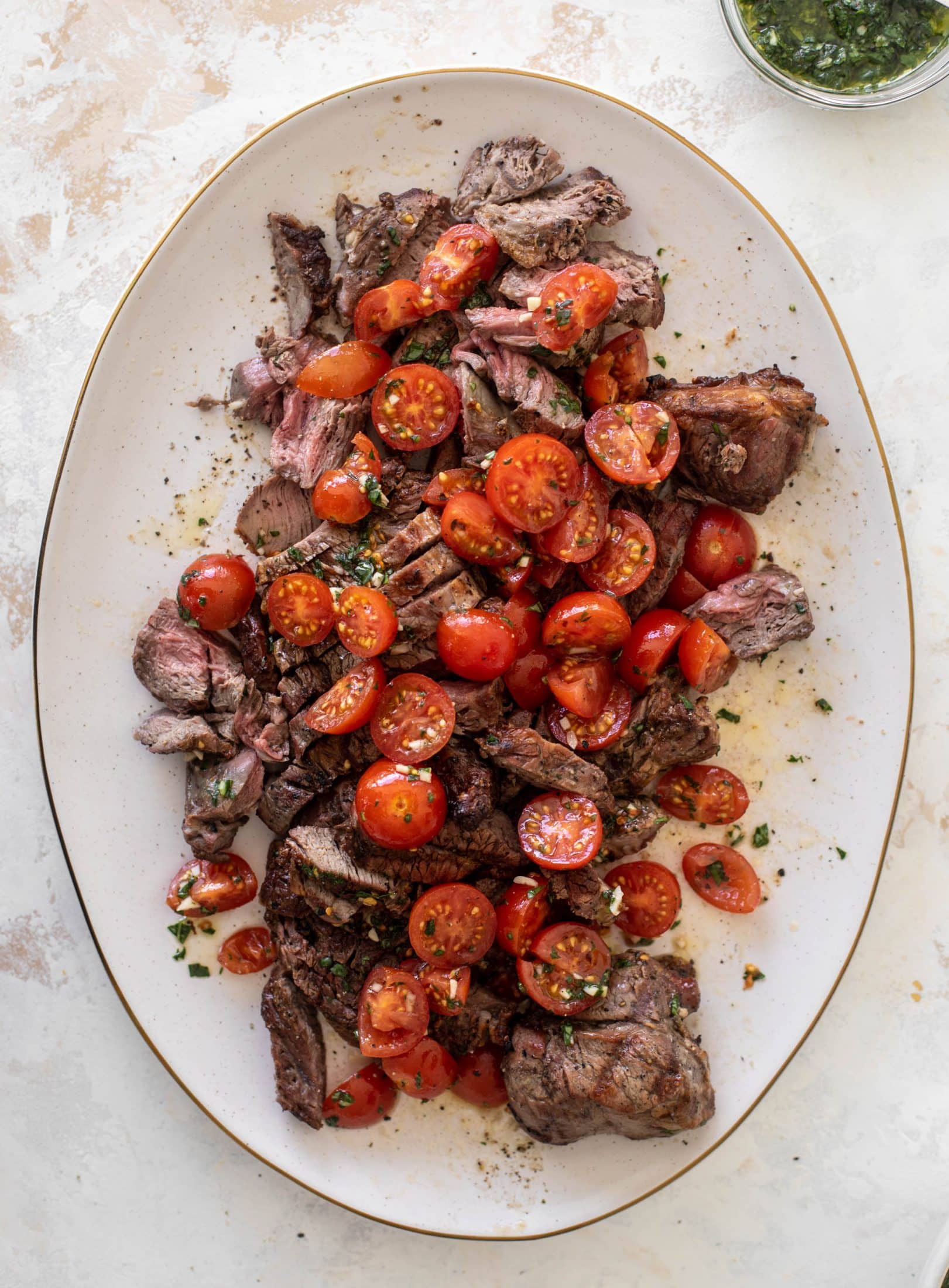 grilled steak with spicy marinated tomatoes